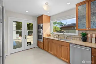 Having the kitchen overlook a big, flat backyard makes it easy to keep an eye on things outside while cooking or hanging out in the kitchen.