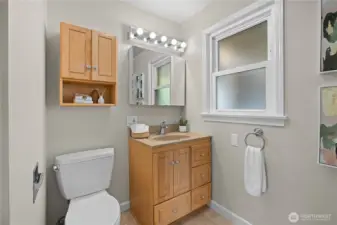 The main floor offers a second full bath for guests.
