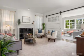 A custom barn door creates open or intimate space with the second living area.