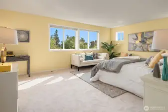 This spacious primary suite with treetop views is your new haven!