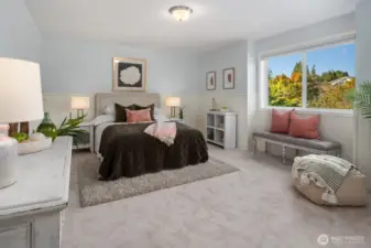 Large additional bedroom with wainscotting.
