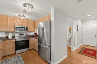 Updated kitchen with abundant cabinet storage in Bellevue Pacific Tower.