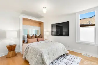 Down the hallway to the upstairs, you'll pass by this main floor bedroom. A queen or king bed could fit here! The owners have a murphy bed installed that can stay with the home, or go!