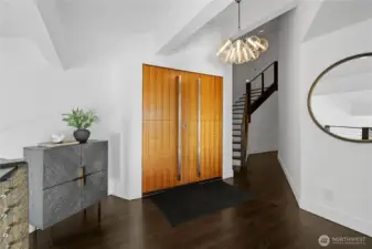The entrance to the home is on the upper level and hosts 3 of the 5 bedrooms