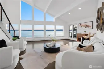 A wall of windows and high ceilings highlight the natural beauty just outside and provides an excellent opportunity for spotting birds, seals, otters, Orcas, and other wildlife