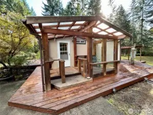 Covered entrance into laundry room offers a nice place to sit even on a rainy day.