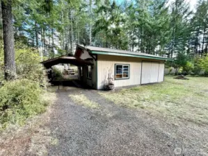 Shop with ample attached carport.