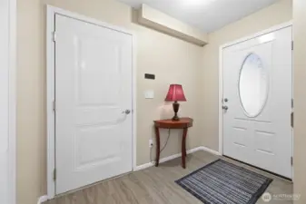 Main door on the garage side. Door to garage.