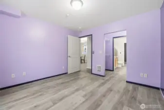 Main bedroom with door to walk-in closet and bath.