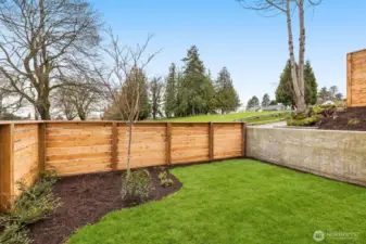 Fully fenced front yard perfect for play or pets.