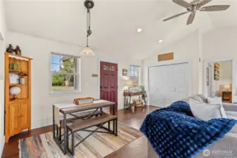 Step into an inviting open living space with vaulted ceilings and a warm, cozy atmosphere.