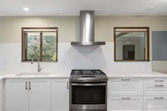 Plenty of light in this fabulous kitchen, clean white tiled back splash providing both elegance and convenience.