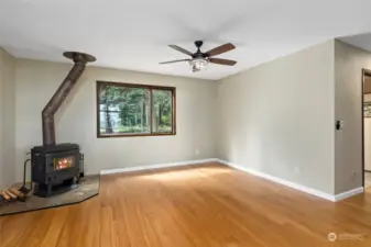 Spacious family room with efficient wood burning stove.