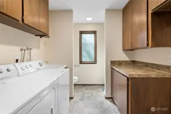 Centrally located spacious Laundry room and powder room.