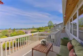 From the sunroom, step out to your full legnth balcony with water views of the Strait