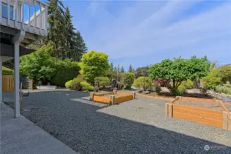 Within this backyard area, there are raised beds, a dog corral and open space to expand one's love for gardening.