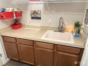 Cabinets & sink in the utility room also give you a place to wash up when you come in from the garage.
