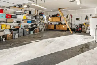 Inside of 24x34 garage/shop. Ample storage, stairs lead to even more storage above! Insulated and sheetrocked. This space could be so many different things! Home office even!