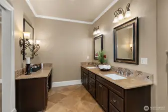 This primary bath is nothing extraordinary. With its luxurious crown molding, beautiful tile heated flooring, and stunning walk-in shower, it creates an atmosphere of sophistication and serenity. Dual vanities offer generous storage, and the massive walk-in closet ensures you have room for all your essentials. And, with a large window by the Jacuzzi tub framing the majestic view, you can relax in style while taking in the breathtaking landscape. It’s a space where every detail contributes to an unforgettable experience—get your spa day scheduled, because this master bath is your personal retreat.
