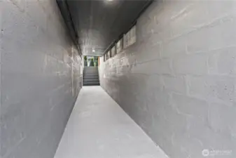 B/Lower Floor: Breezeway with Stairs at one end that lead to the Front Parking and Stairs to the Backyard.