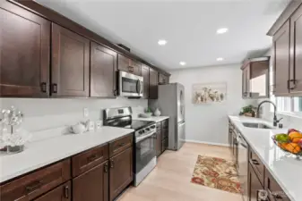 A/Main Floor: New Laminate Floors, Shiny New Stainless Steel Appliances, Recessed Lighting.