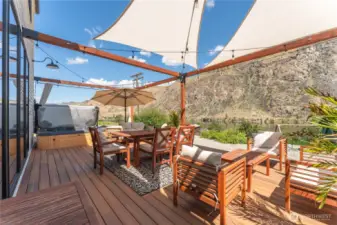 Ground level deck with hot tub facing breathtaking views of the Columbia River