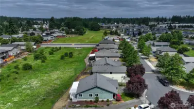 Playground with hoop court & green space is off to the right...