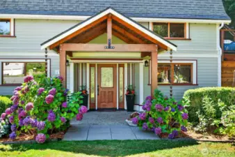 Warm reclaimed wood beams meets modern living in this barn to home conversion with new windows, new paint inside and out.