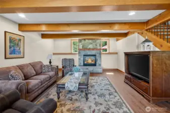 Stone hearth and gas fireplace give this living room warmth of all the elements, fire, stone and wood!