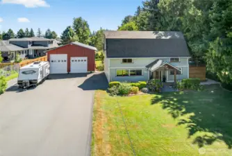 Low maintenance blacktop driveway with room for lots of parking.