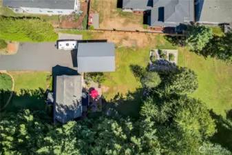 Aerial of backyard, shaded dog run, house and shop