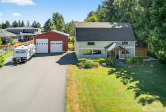 Front black topped driveway with access to shop.  Plenty of parking for RV, boat or cars.