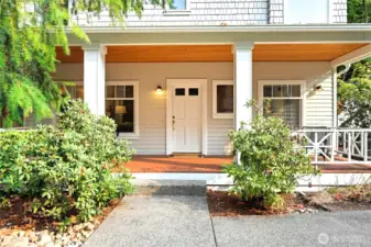 Sunny front porch, room for 2 seating areas.  Enjoy the peace and quiet of this lovely setting.