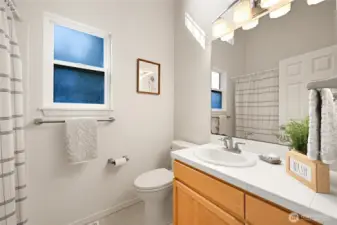 Upstairs full bathroom with extra-high ceiling to let the sun shine in.