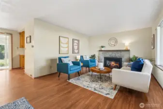 As you come in the front door the generous living room with gas fireplace is here.