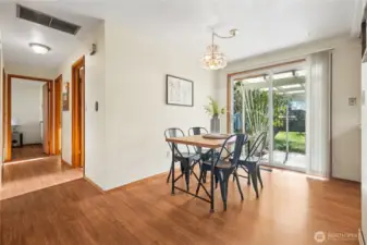Here's the dining room, it's just off the kitchen and living room. The slider takes you out to the fully fenced private back yard, PLUS the HUGE covered patio.
