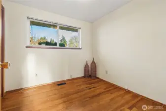 Bedroom #2, this is the smallest bedroom of the 3, and it has original hardwoods too, and a large closet to the left. Has been an office before.