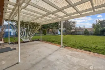 Looking at the backyard from the covered patio. Fully fenced backyard great for pets or little people!