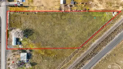The property is quite large at 2.27 acres, and all level ground with a septic tank and electricity on it. The house right next door is occupied and not part of the vacant land listing.