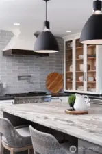 Leathered granite island with built-in cabinets