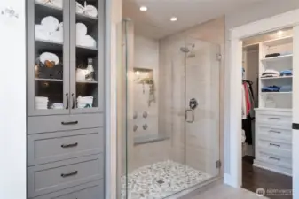 Huge shower with dual shower heads and jetted seat