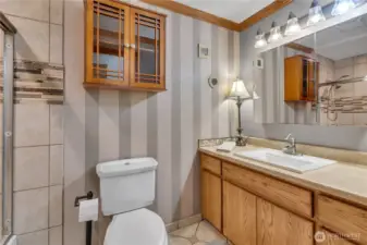 The main bath has custom lighting and a full tub/shower glass enclosure!