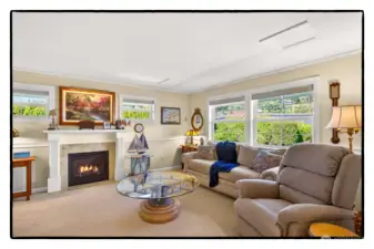 Second family room/den with one of four fireplaces in the home.