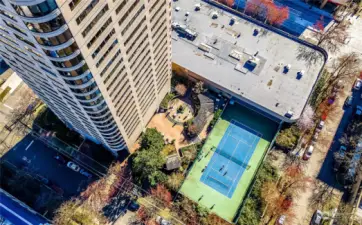 Enjoy the courtyard with amenities including tennis courts, pickleball, a fountain, BBQs, and plenty of seating options