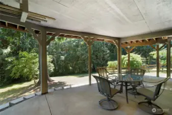 Covered patio with peaceful and private views of the property.