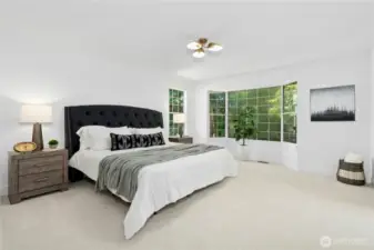 Primary bedroom with a view of nature just beyond!