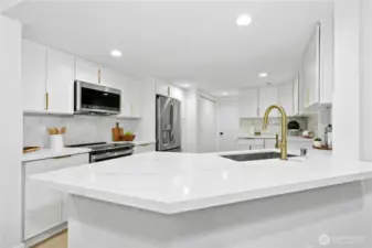From quartz counters and ample cabinetry to stainless appliances and gorgeous gold accents: ALL NEW and very stylish!