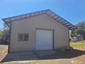 Spacious 30' x 45' shop with a large garage door—perfect for bringing in equipment to work on. Includes a 160 sq ft office and a wood stove to keep the space warm and comfortable year-round.
