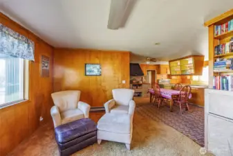 Fabulous views from every window! The cozy sitting area off the kitchen, warmed by a wood stove, keeps things toasty year-round. The kitchen includes a convenient butler’s pantry and separate laundry area. Step outside through the backyard door to enjoy patio BBQs and relaxing outdoor moments.