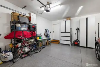 This spotless garage is fully finished with smooth drywalled walls giving it a clean and polished look.